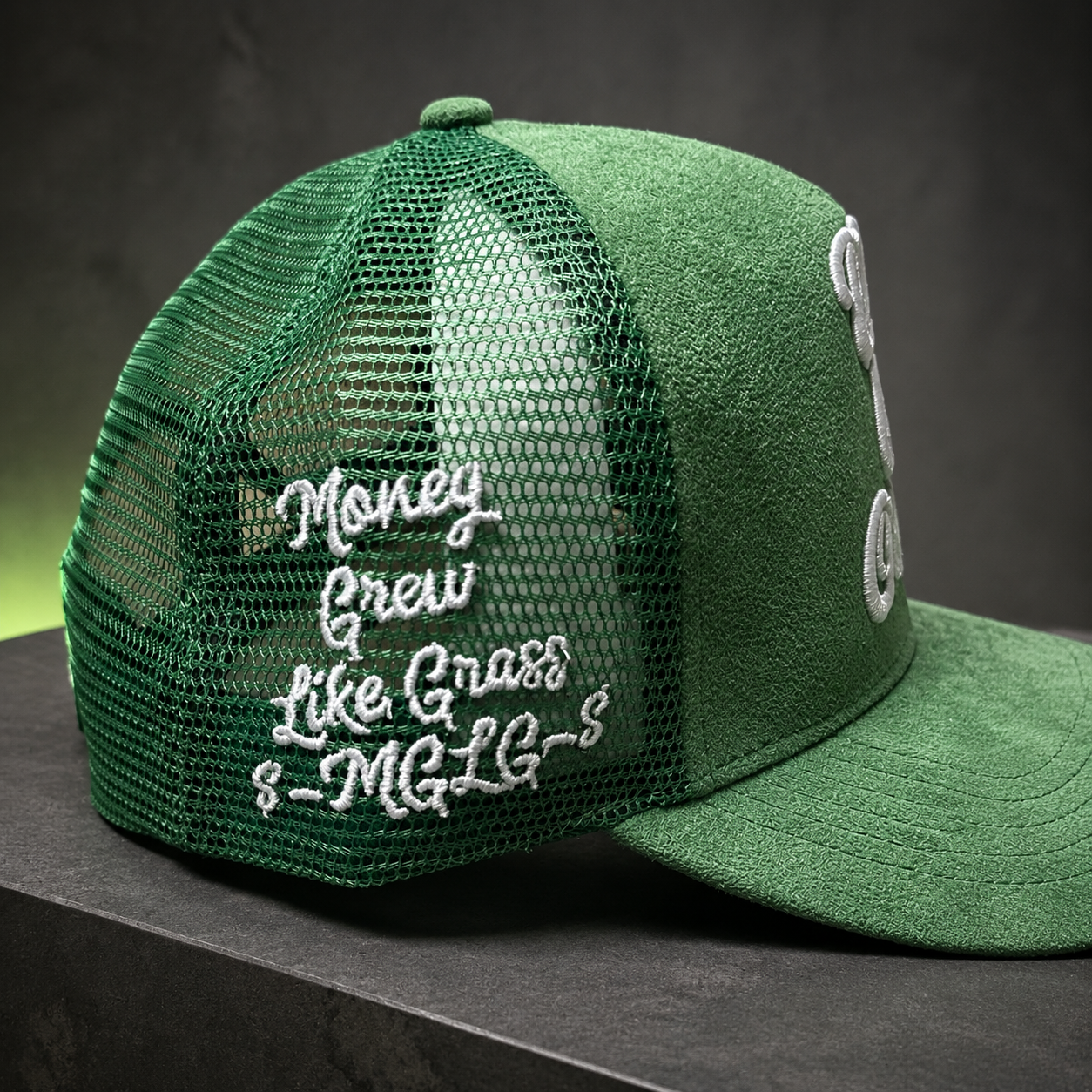 Green Rich Off Creativity cap showing Money Grow Like Grass side embroidery